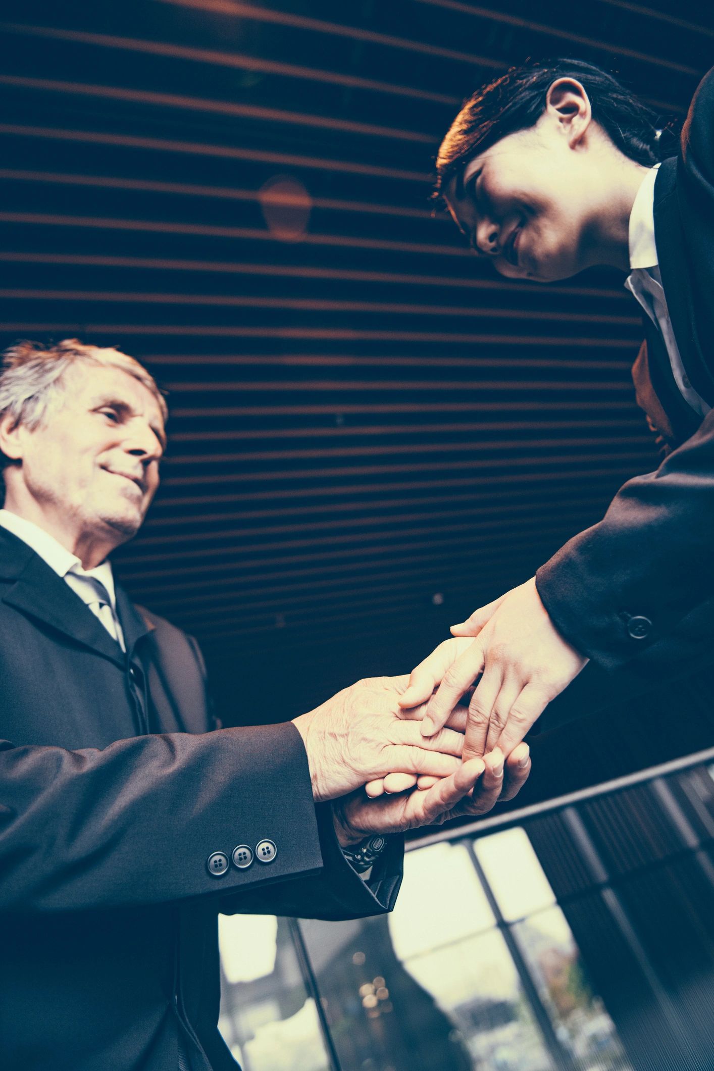 Business owners shaking hands after reaching a deal